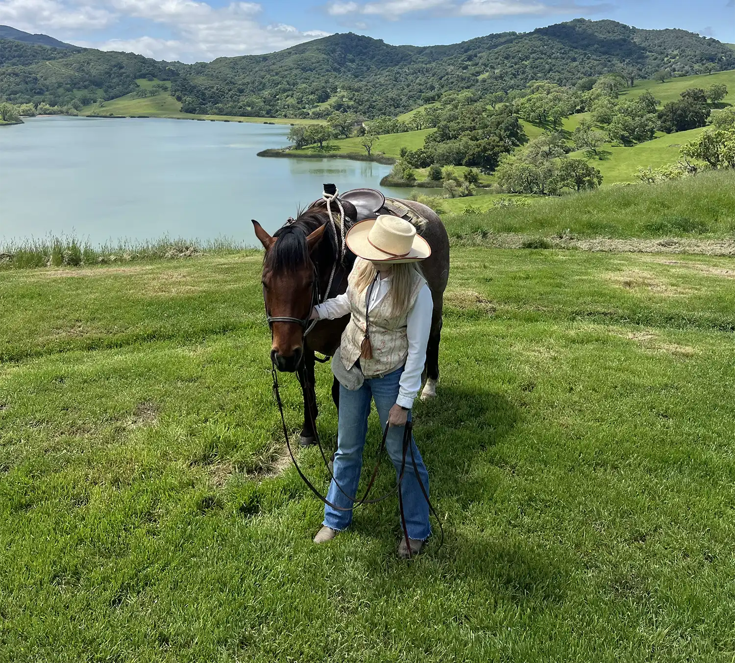 a woman bonding with her horse during the women's retreat at Alisal Ranch