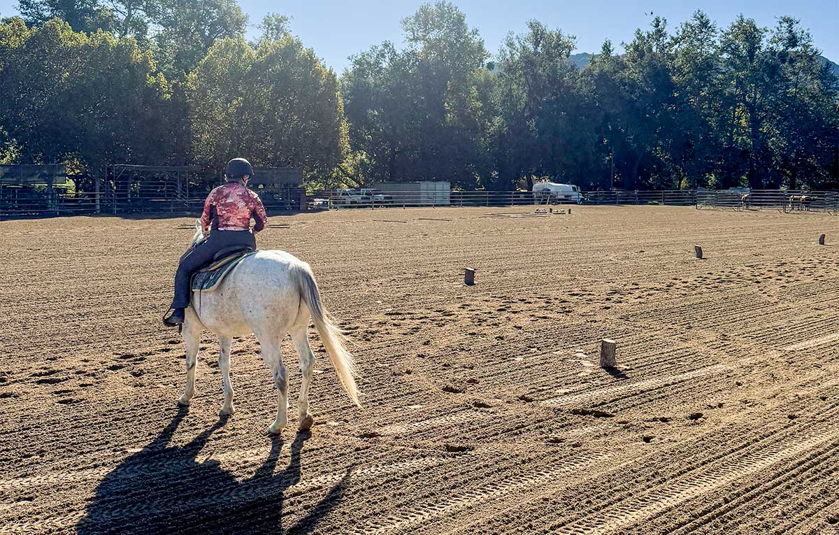 Guest practicing patterns during our women's horseback riding retreat in California.